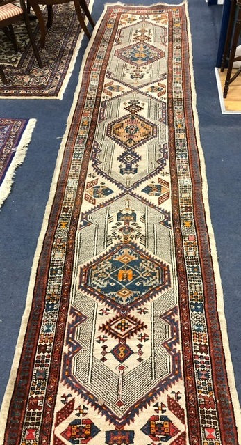 A Hamadan ivory ground runner 425 x 95cm